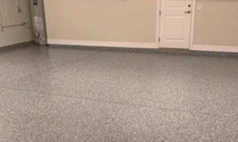 Epoxy floor coated with flakes.